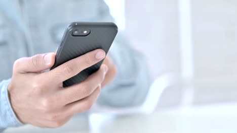 Close-Up-of-Hands-adding-Credit-Card-in-Smartphone