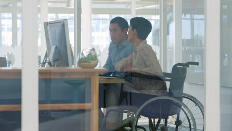 Young-man-and-woman-working-in-a-creative-office