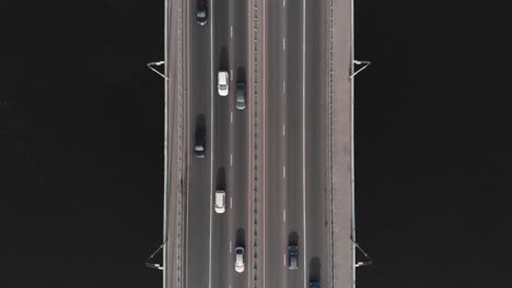 Highway-bridge-traffic-aerial-top-view-time-lapse-colorful-cars