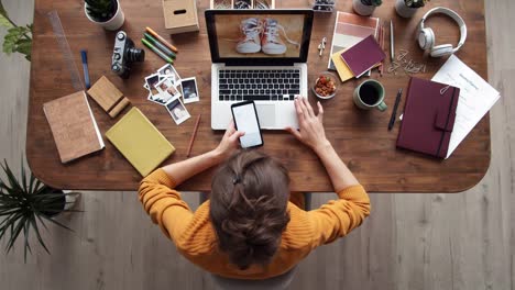 Woman-Working-on-PC-and-Cellphone