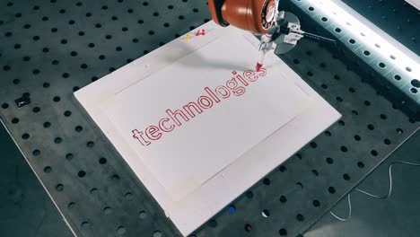 Robotic-mechanism-is-writing-on-paper-with-a-sharpie