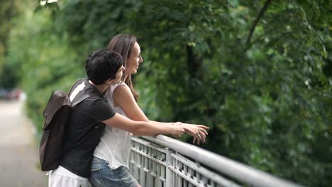 Happy-in-love-lesbians-standing-on-the-bridge