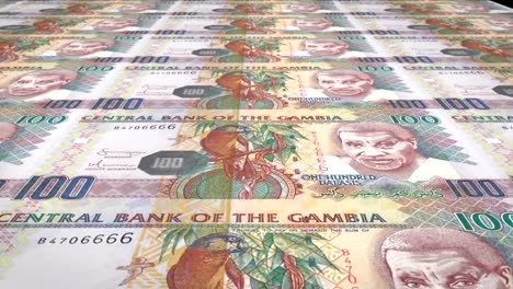 Banknotes-of-one-hundred-gambian-dalasis-of-Gambia-rolling,-cash-money,-loop