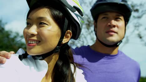 Asian-Chinese-male-female-couple-cycling-outdoors-together