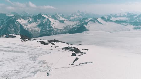 Aerial-view-of-astonishing-nature-snowy-rocky-peaks-scenery