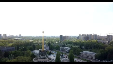 Panoramic-video-from-the-drone-to-the-National-Exhibition-Center-and-Kyiv-National-University-T.-Shevchenka,-Kyivskiy-Ipodrom-in-Kiev,-Ukraine.-Slow-motion-view-in-FullHD-high-resolution-video