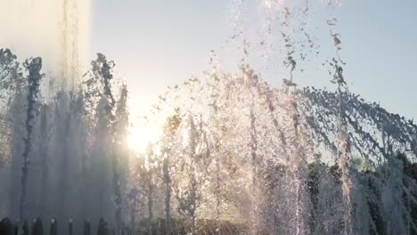 Water-fountain-in-park-at-sunset.-Slow-motion