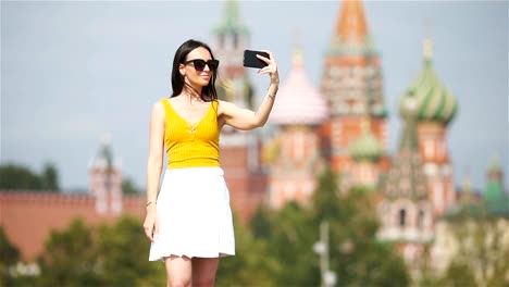 Happy-young-urban-woman-in-european-city.