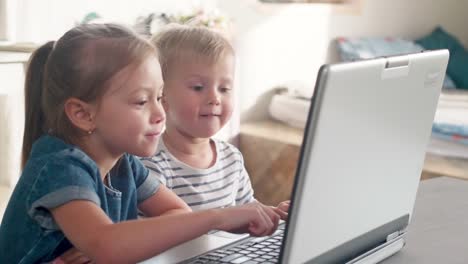 Little-Kids-Watching-Cartoon-on-Laptop