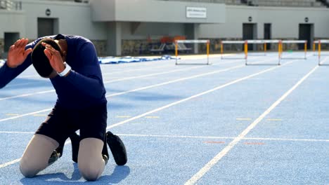 Disabled-athletic-relaxing-on-a-running-track-4k