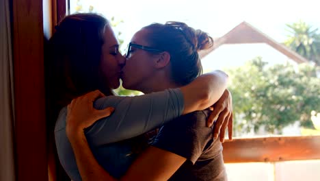 Lesbian-couple-kissing-each-other-at-home-4k