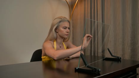 Sexy-attractive-adult-girl-work-with-transparent-glass-monitor