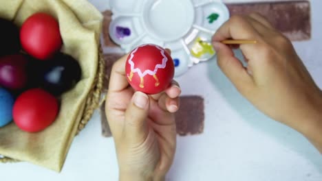 Happy-Easter-on-table-decorated-with-easter-eggs.