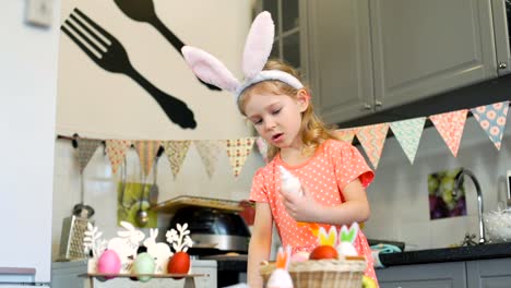 Girl-Tasting-Cream-while-Decorating-Cookies