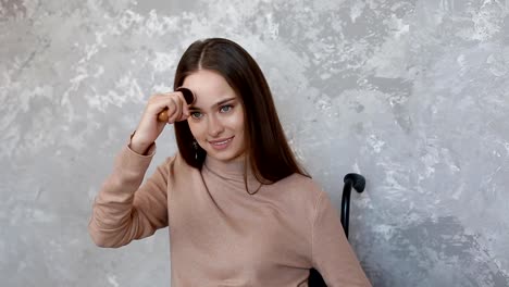 Disabled-young-woman-applying-powder-on-her-face