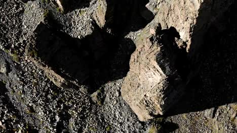 Aerial-view-of-structured-rocks-with-crumbling-debris.-Cellular-rocks.