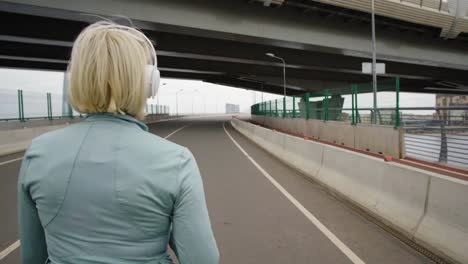 Woman-Walking-on-Bridge