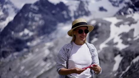 Excited-caucasian-female-tourist-using-good-roaming-connection-in-mountains-Park-making-video-call-with-friends