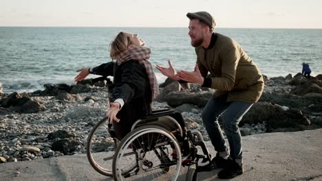 Man-cheering-up-disabled-woman-he-loves