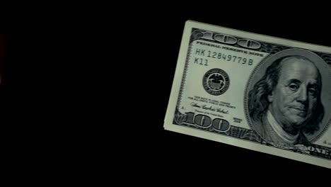 Slow-motion-of-a-hand-giving-a-dollar-bill-in-another-hand