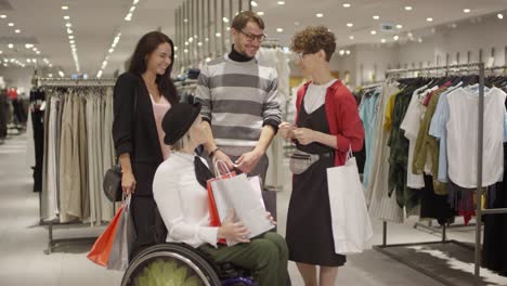 Happy-Group-of-Friends-Chatting-in-Clothing-Store