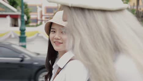 Happy-Asian-lesbian-couples-walking-on-the-street-enjoying-traveling-in-Thailand.-Beautiful-young-women-having-fun-in-vacation-time.-LGBT-concept.