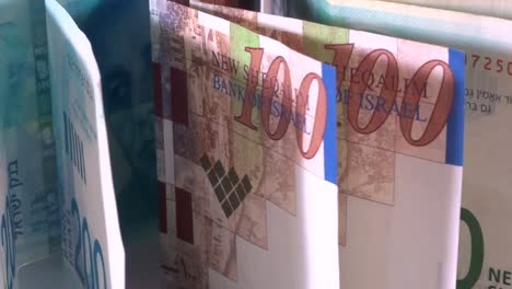 Israeli-money,-shekels-bills-in-motion