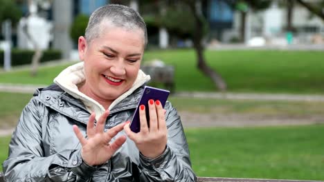 Woman-using-smartphone-at-the-outdoor