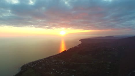 Aerial-view-of-sunset-over-New-Athos,-Abkhazia.