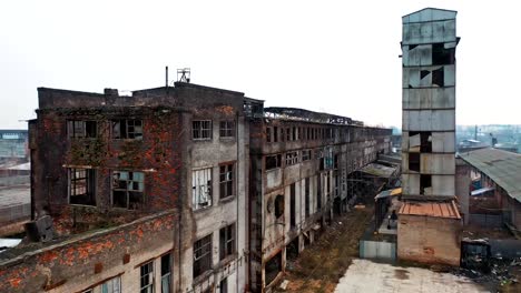 Aerial-view-of-an-old-factory-ruin-and-broken-windows.