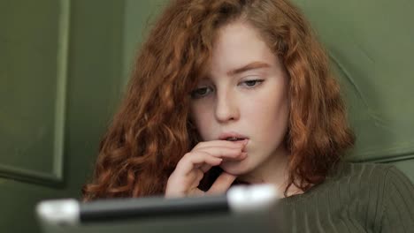 Close-up-Shot-of-Young-Girl-using-Tablet