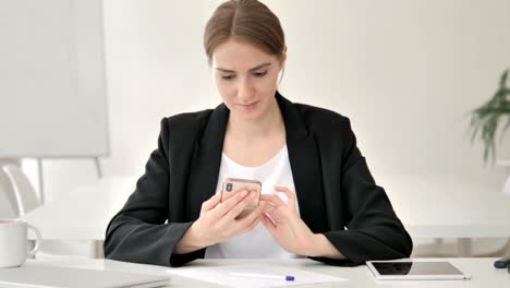 Young-Businesswoman-Using-Smartphone