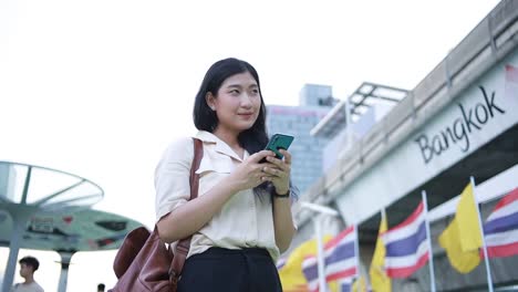 Asian-woman-using-mobile-phone