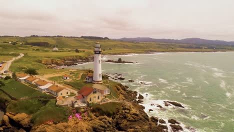 Light-House-Drone-Shot-Aerial-Helicopter-View-Ocean-Coast-Line-with-crashing-waves-sun-set-4K