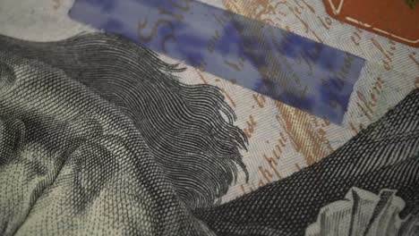 American-one-hundred-dollar-paper-banknote-in-close-up-macro-view-dolly-shot.