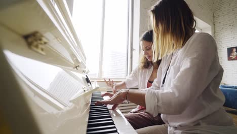 Girlfriends-playing-on-piano