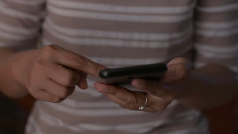 Close-up-woman-hands-using-mobile-smart-phone-for-communication.