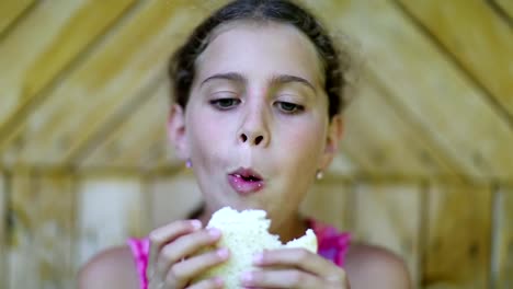 Hungry-girl-eats-white-bread