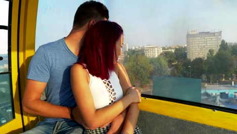 Romantic-couple-cuddling-and-having-perfect-time-together-in-ropeway