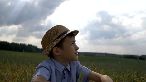 dreamer-boy-in-the-hat-looks-at-the-beautiful-sky