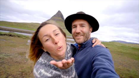 Slow-motion-Selfie-portrait-of-tourist-couple-in-Iceland-at-Kirkjufell-mountain