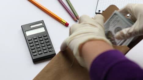 Counting-money-and-puting-in-envelope