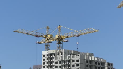 A-lake-against-the-background-of-houses-under-construction.-Skyscrapers-are-built-near-the-lake.-Construction-of-residential-buildings-near-the-lake.