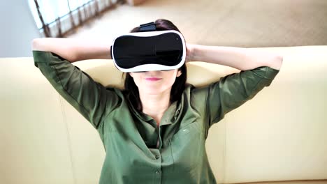 Medium-shot-happy-woman-smiling-and-relaxing-wearing-virtual-reality-headset