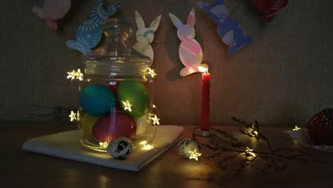 Easter-decoration-burning-candles-eggs-garlands