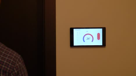 Smart-home-climate-control-device-on-a-wall