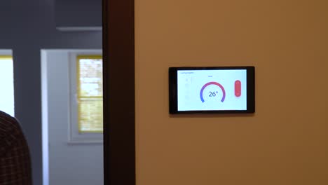 Smart-home-climate-control-device-on-a-wall