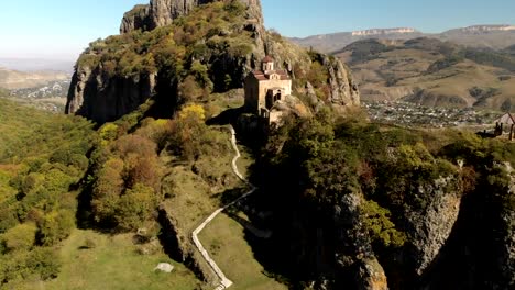 4K-UHD-Aerial-view-of-a-mountain-monastery-standing-on-a-cliff