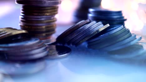 Double-exposure-of-city-view-and-rows-of-coins-for-finance-,-money-,-investment-and-business-concept-background