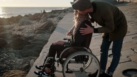 Handicapped-woman-with-boyfriend-near-the-sea